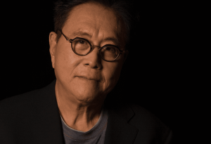 Robert Kiyosaki warns of a 2025 financial crisis, urging investment in gold, silver, and Bitcoin.